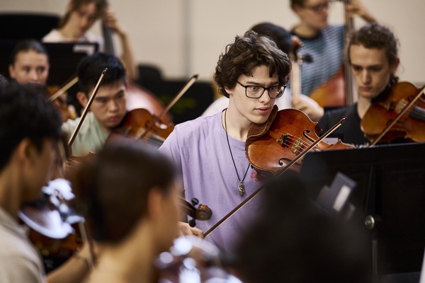 Alex Monro playing principal viola in Australian Youth Orchestra's Alexander Orchestra at National Music Camp 2026, photo by Claudio Raschella